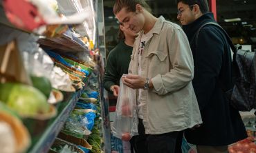 Photo of students shopping at a local fruit and vegetable shop